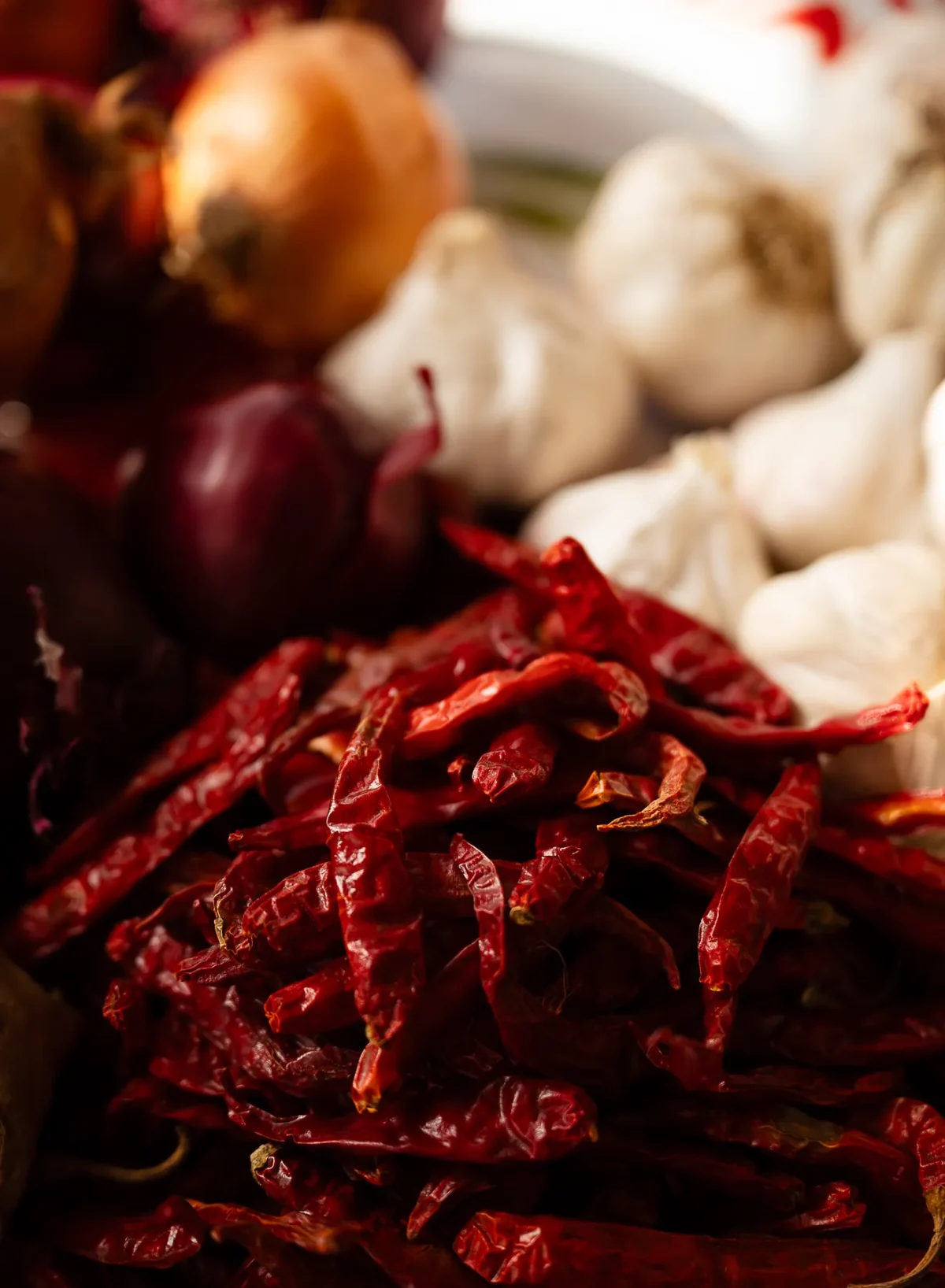 Dried red chillies, garlic and red onions ready for the pan