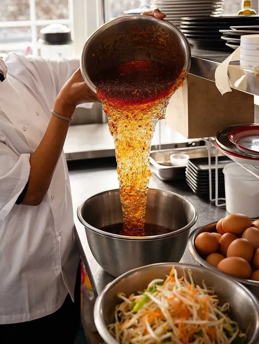 Home-made sweet chilli sauce being poured